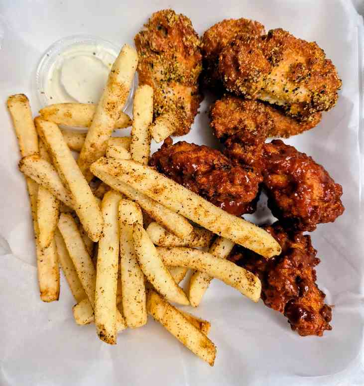 Crispy halal chicken wings with seasoned fries