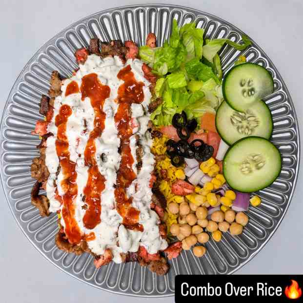 Chicken and lamb gyro combo over rice with salad
