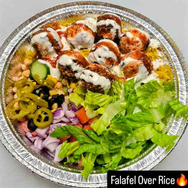 House-made falafel over rice with garlic sauce and hot sauce