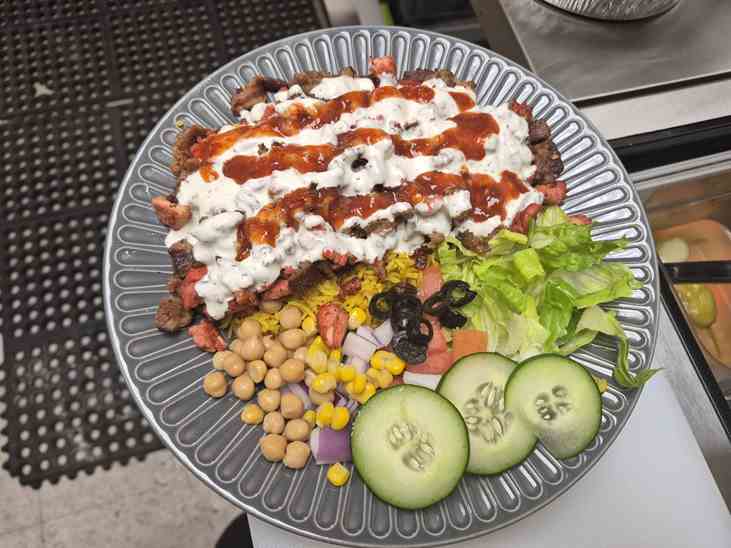 Mix BBQ platter with lamb chops, chicken tikka and beef botti over rice